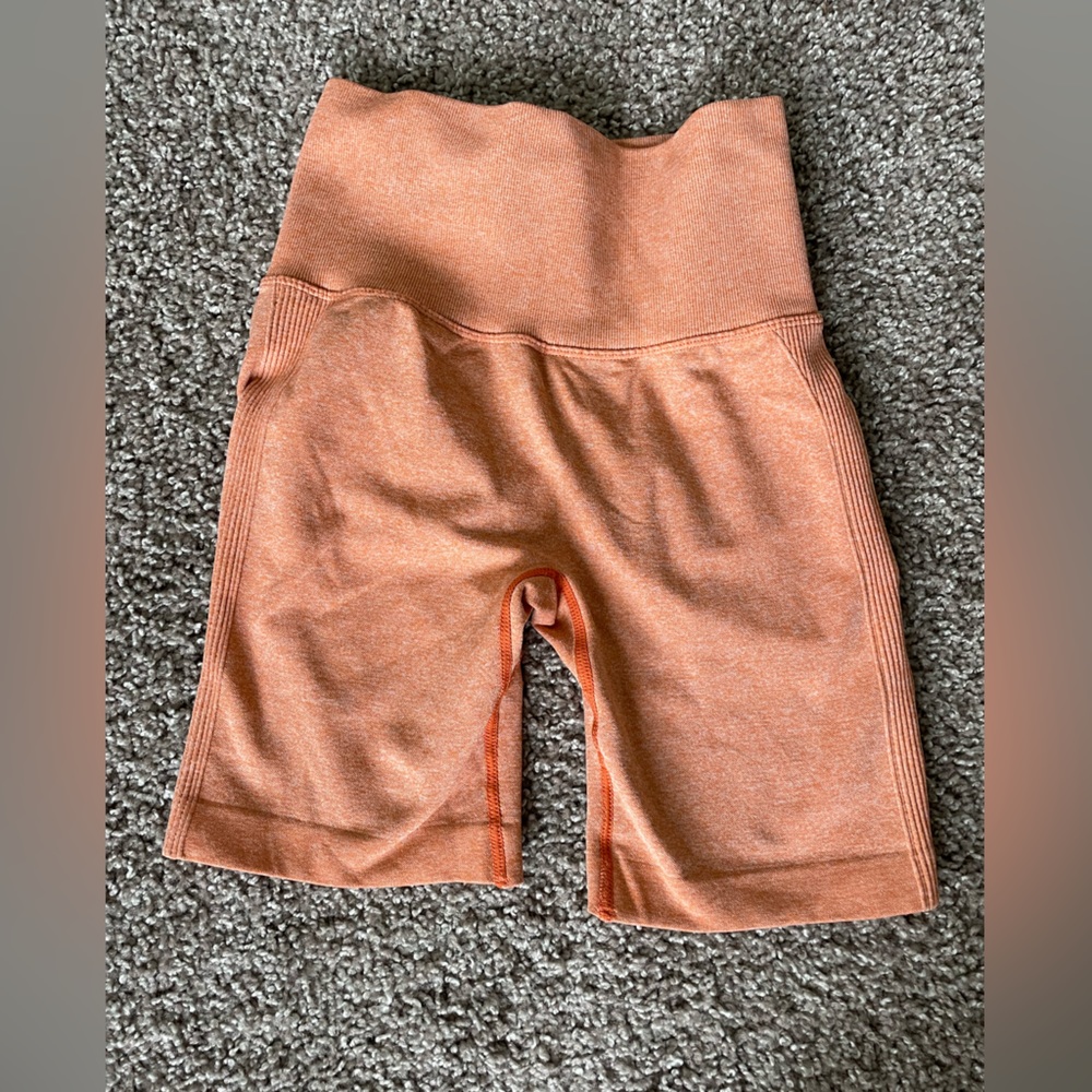 Orange butt scrunch biker shorts
